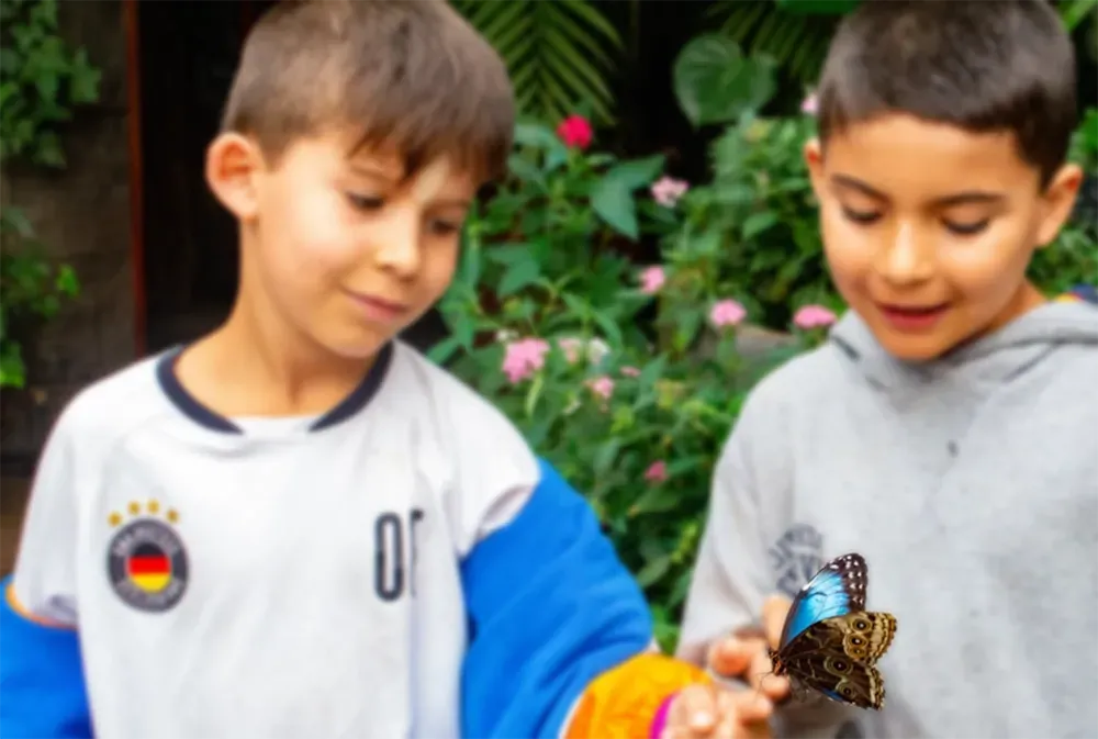 boys with butterfly Costa Rica