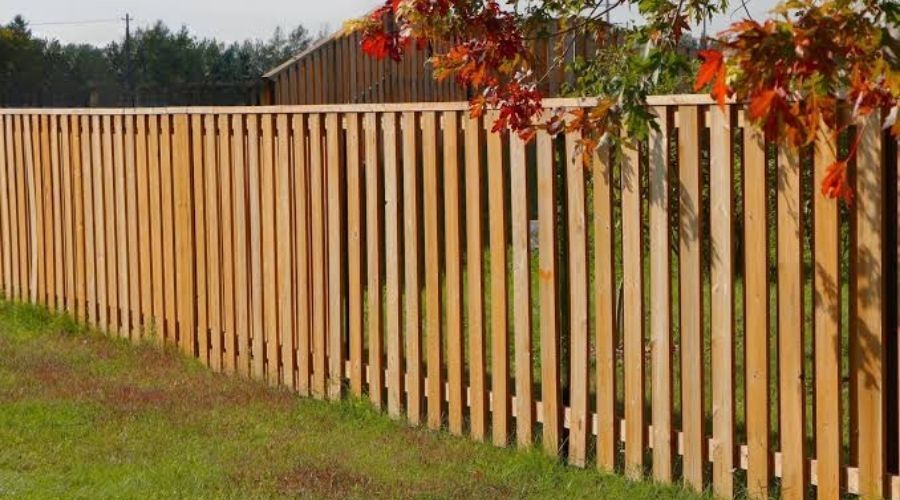 Vertical wood semi-privacy fence design ideal for shared neighbor boundaries.