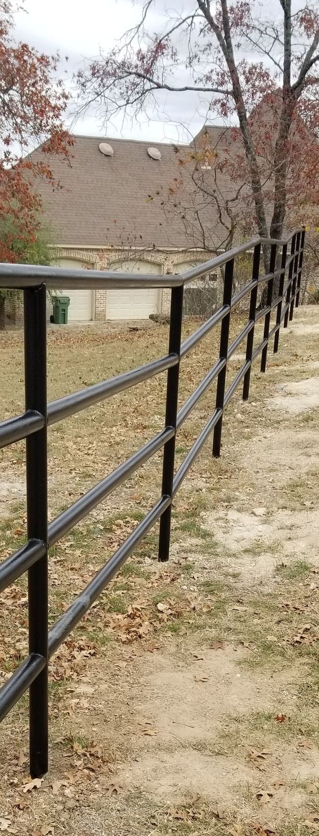 Four rail metal pipe fence