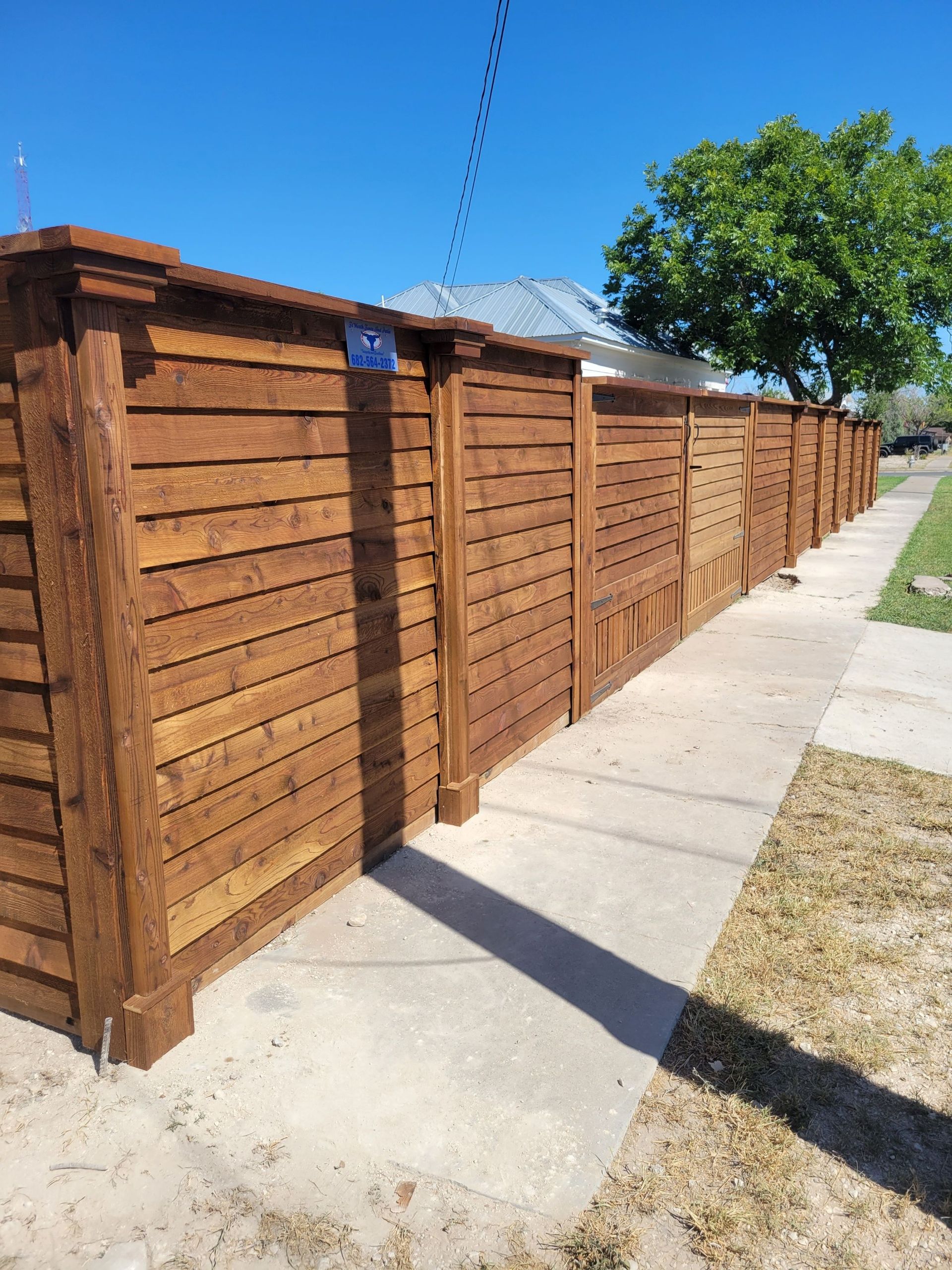 Horizontal board on board wood privacy fence
