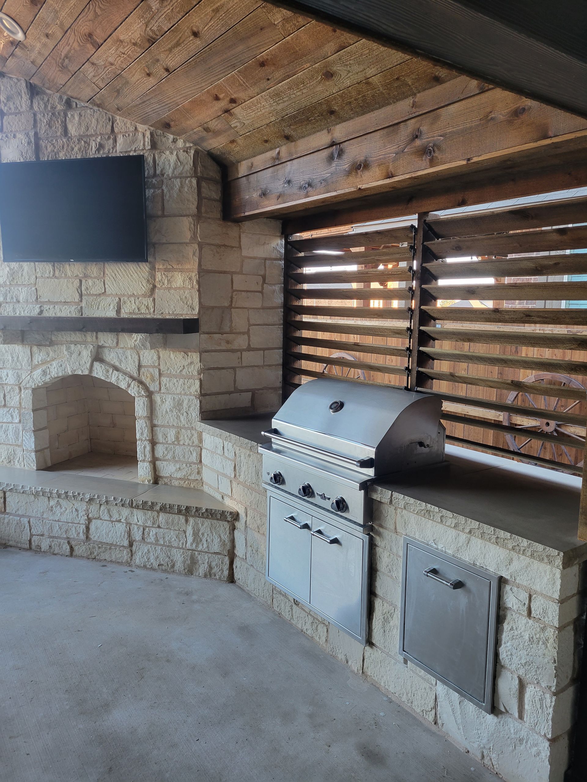 Our outdoor kitchen services are crafted to redefine al fresco dining and entertaining, blending functionality with aesthetic appeal. We specialize in designing and building custom outdoor kitchens tailored to your lifestyle and preferences. Whether you envision a sleek modern kitchen with state-of-the-art appliances or a rustic cooking space with natural stone accents, our expert team brings creativity and expertise to every project. From initial consultation to final installation, we prioritize quality craftsmanship and durable materials to ensure your outdoor kitchen withstands the elements while enhancing the beauty of your outdoor living area. Transform your backyard into a culinary oasis where gatherings are elevated and memories are savored with our comprehensive outdoor kitchen services.
