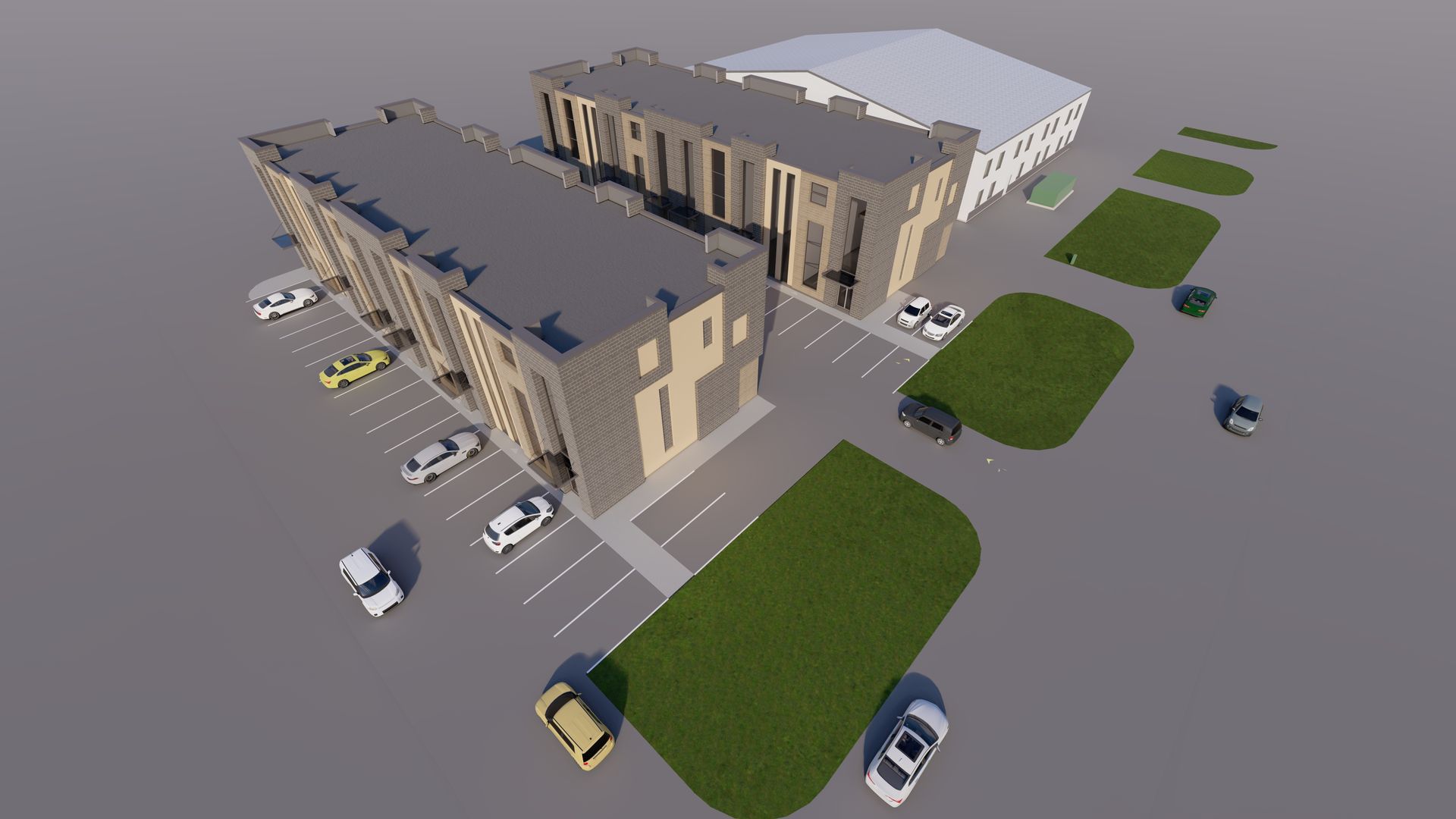 An aerial view of two multi-story apartment buildings with tan siding, a parking lot, and green lawn areas.