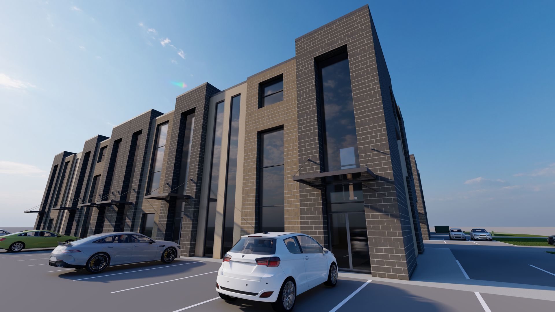 A modern, dark brick multi-story commercial building with large glass windows, set in a parking lot with parked cars.