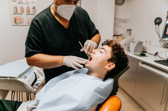 Dentist working on man's teeth — Geneva, NE — Geneva Family Dentistry Dentist working on man's teeth — Geneva, NE — Geneva Family Dentistry