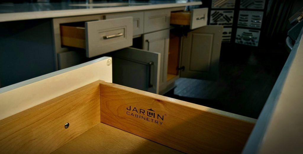 Open drawer in a dim office or lab, with shelves and cabinets in the background