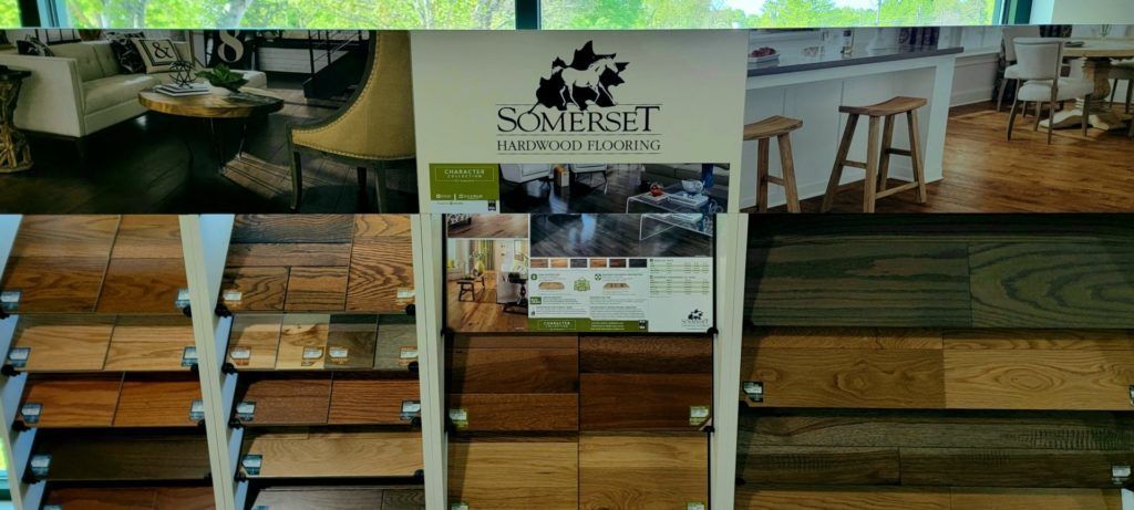 Wooden display wall with shelves, hanging baskets, and a central sign in a rustic shop interior.