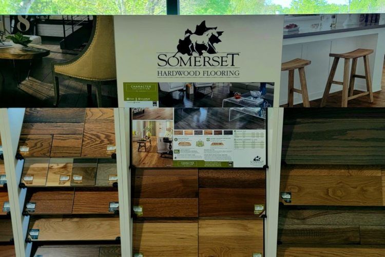 Somerset Heritage Fields sign above wood display shelves in a rustic interior