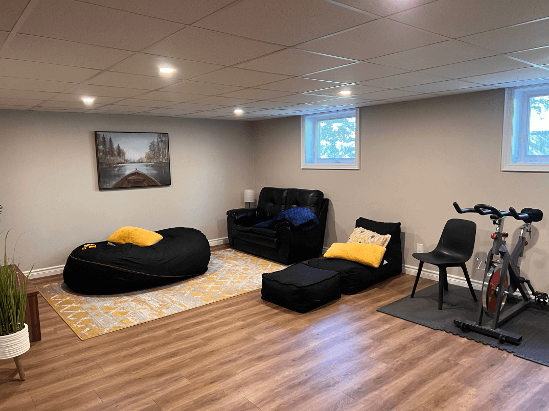 A lounge area with some seating and a window