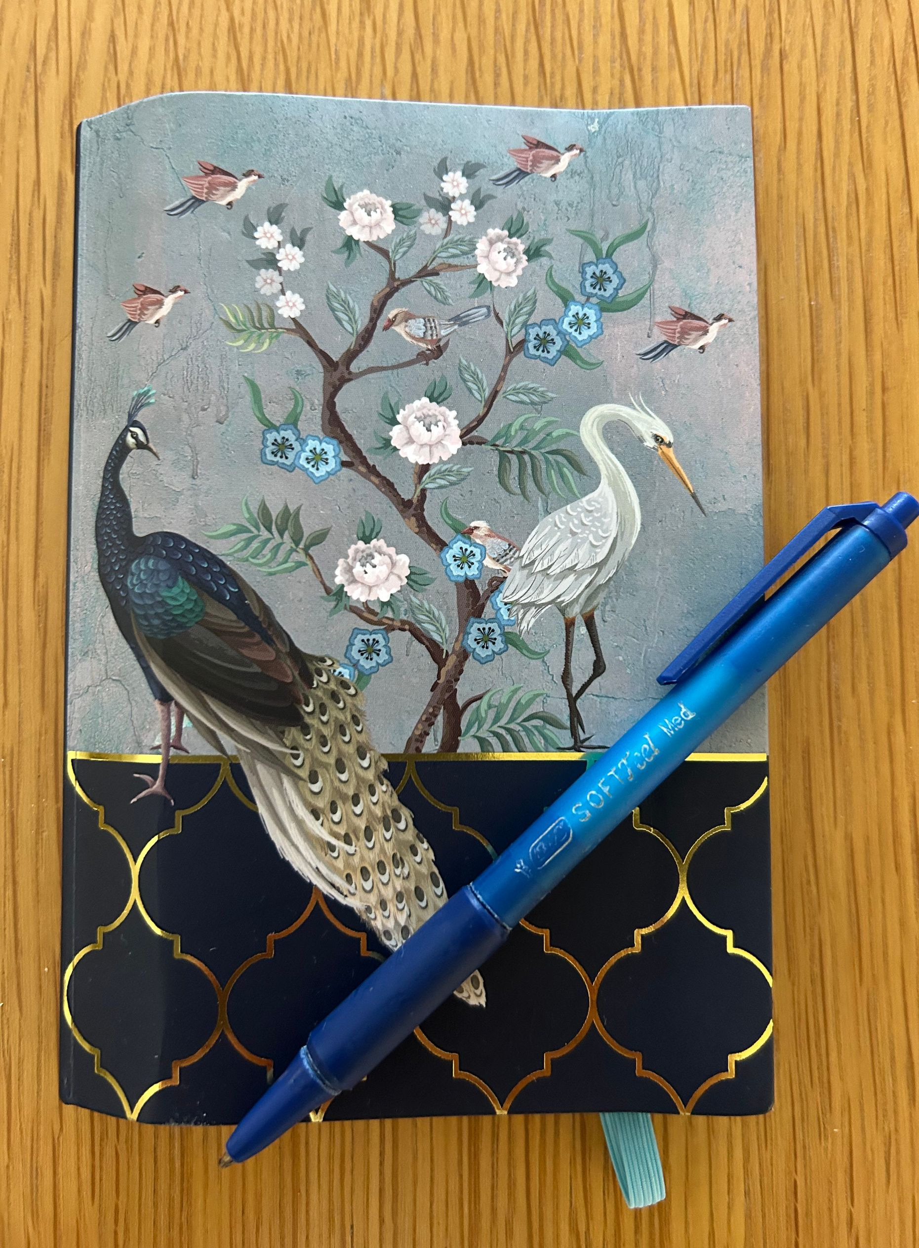 photo of a beautiful notebook and pen