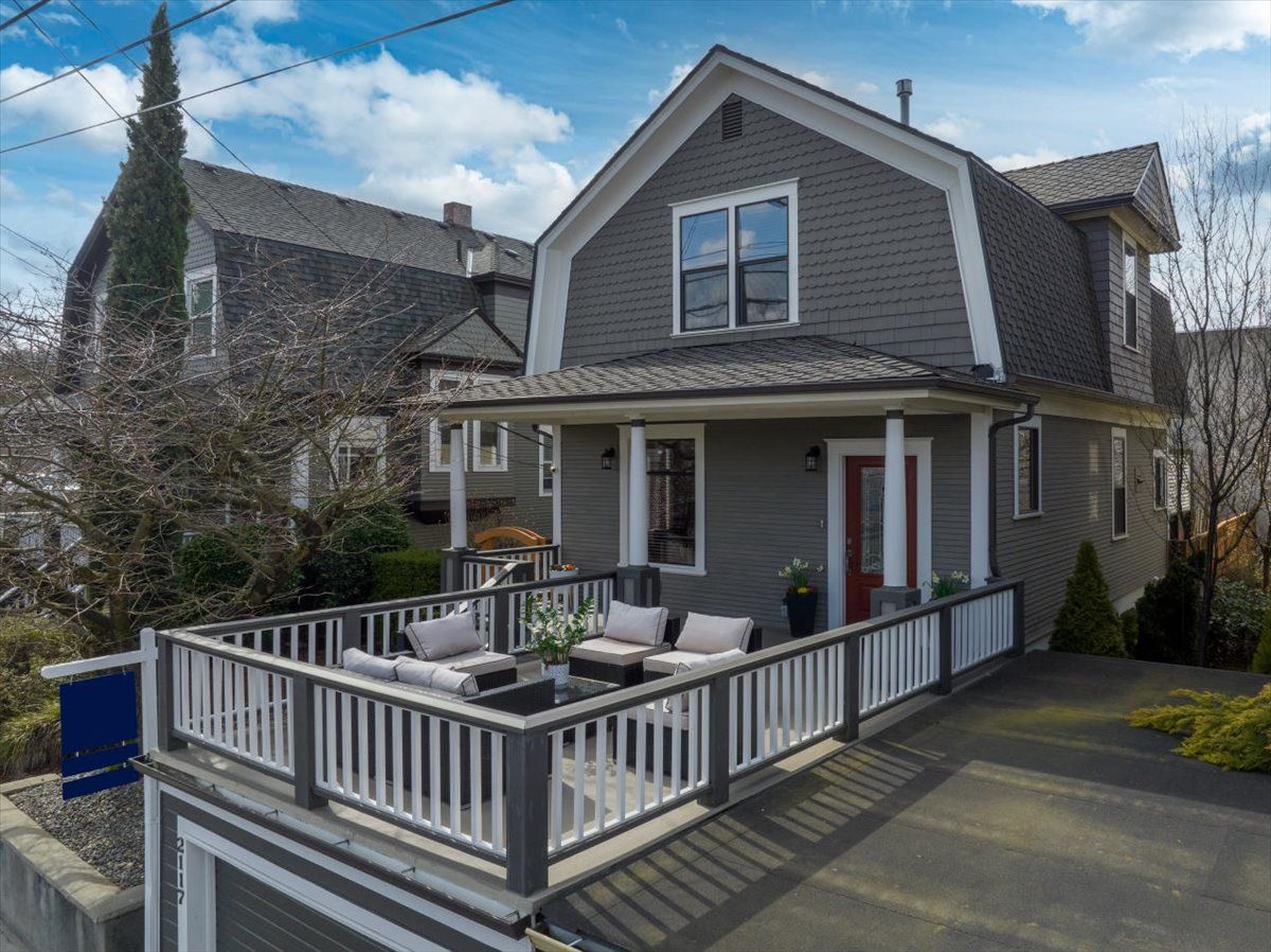 An aerial view of a house with a large porch.
