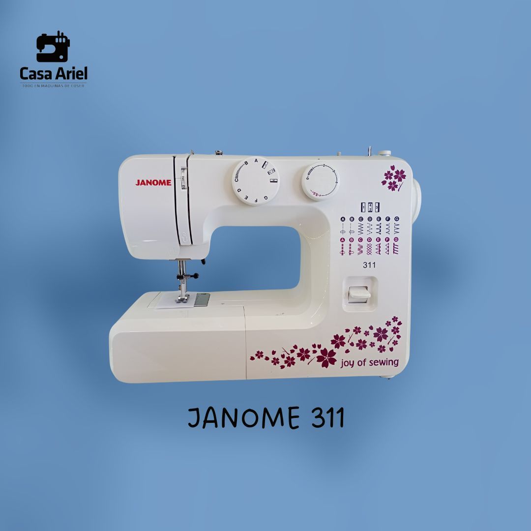 Una máquina de coser Janome 311 blanca con flores rosas.