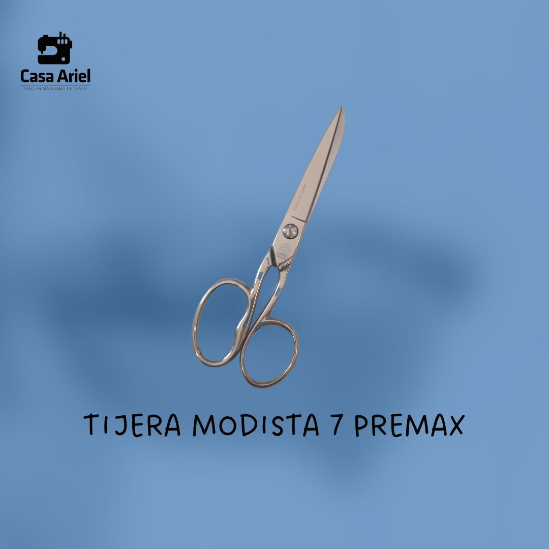 Unas tijeras sobre un fondo azul que dice tijera modista 7 premax
