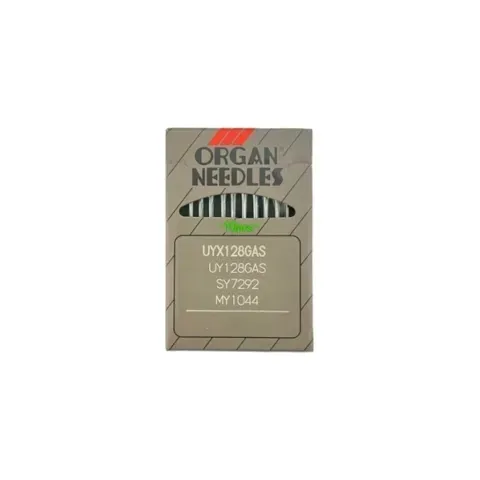 Un paquete de cartón gris con agujas para órganos etiquetadas como UYX128GAS, SY7292 y MY1044.