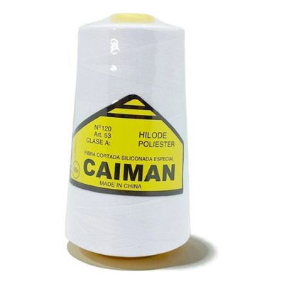 Un carrete de hilo de coser blanco de la marca 