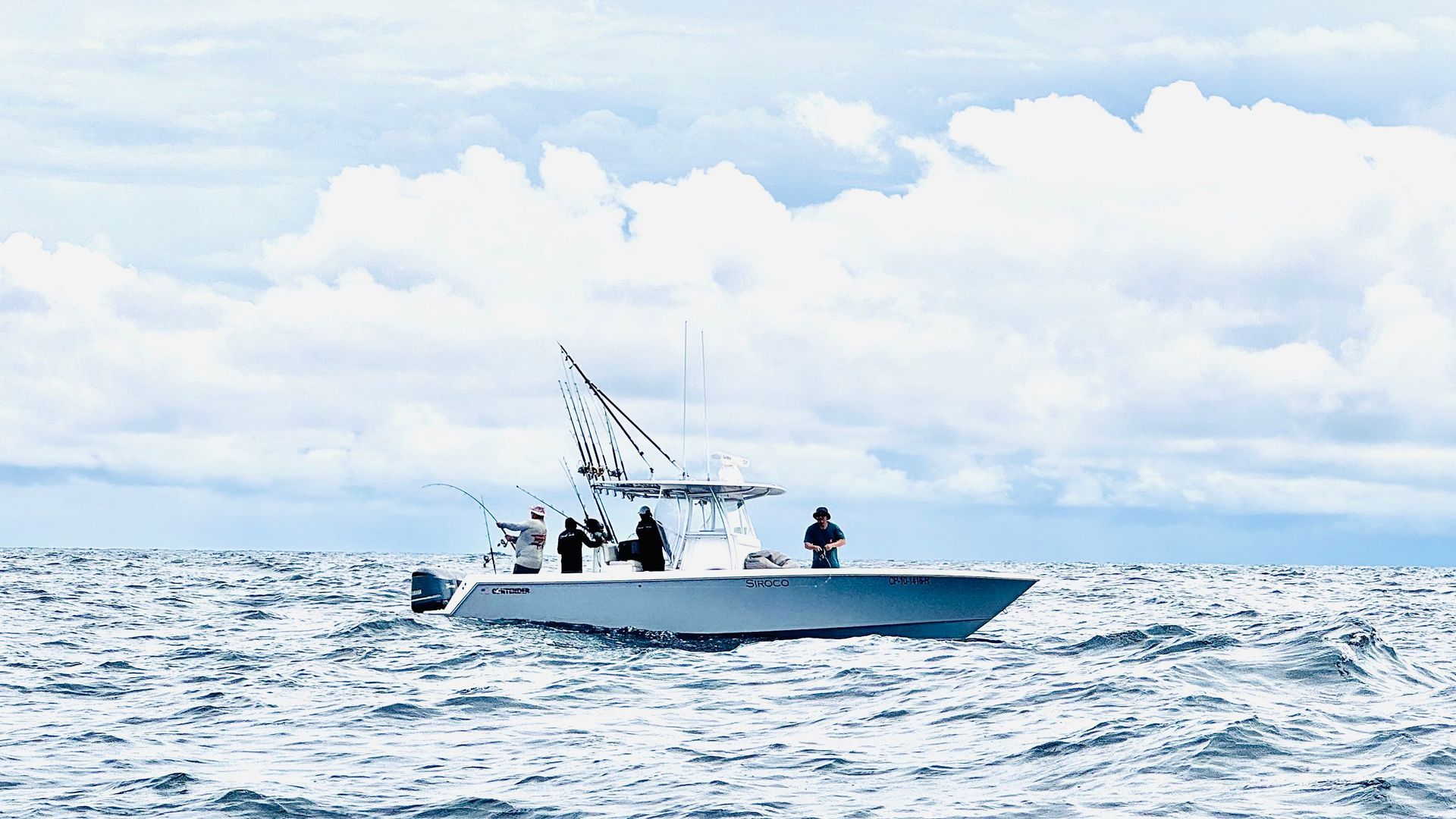 A boat is floating on top of a large body of water.