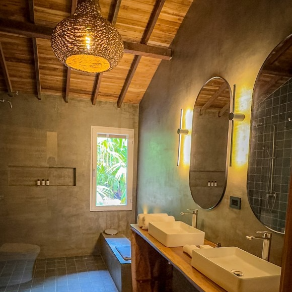 A bathroom with two sinks and two mirrors