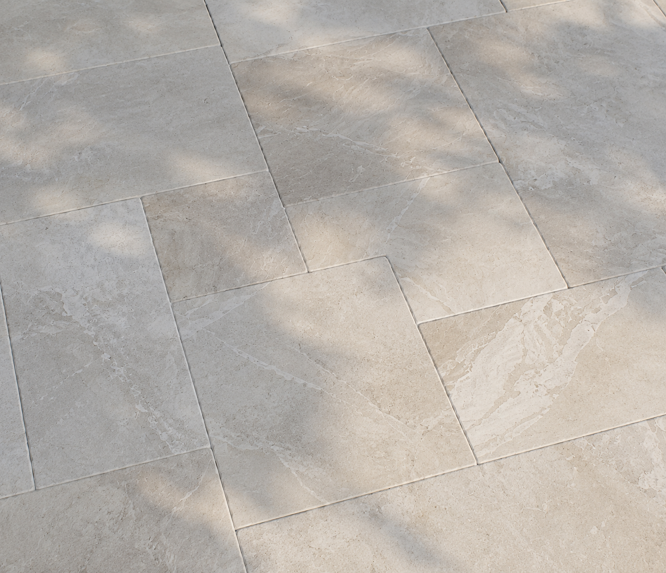 Light beige marble stone tile pavement with subtle shadows and color variation