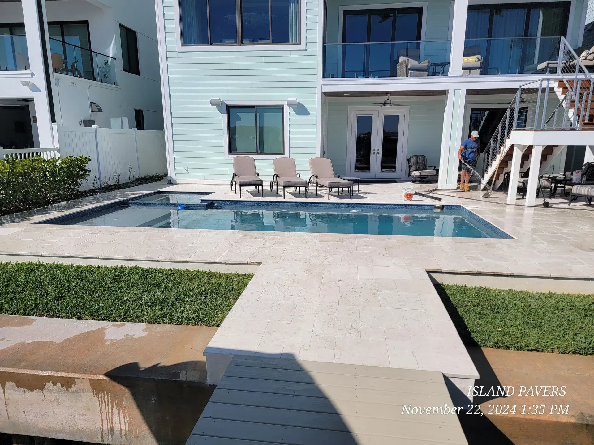Patio with a small pool overlooking a calm waterfront under a blue sky in Tampa Bay, Florida