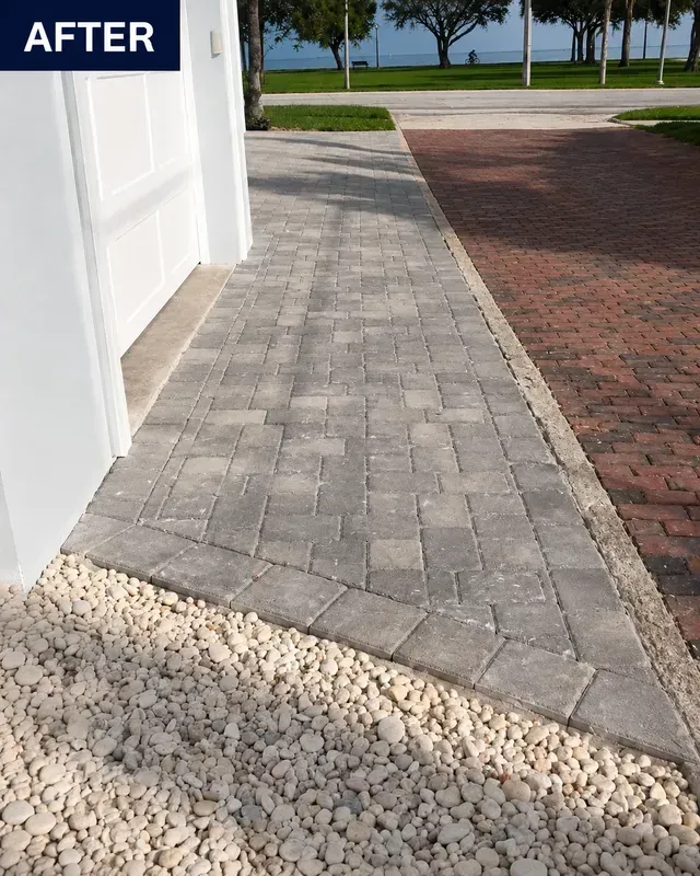 Paver walkway beside a white garage, labeled “AFTER,” with a driveway and lawn in the background