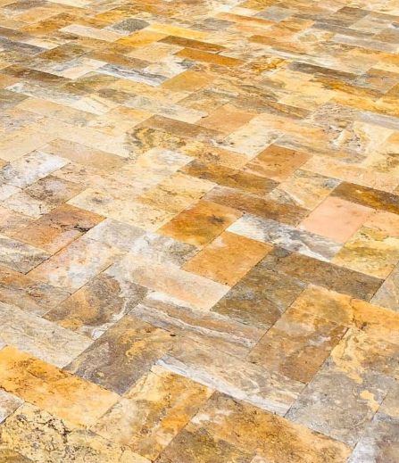 Yellow and gray travertine tiled stone pavement in florida
