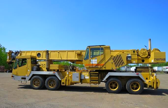 A boom truck ready to go for crane service.