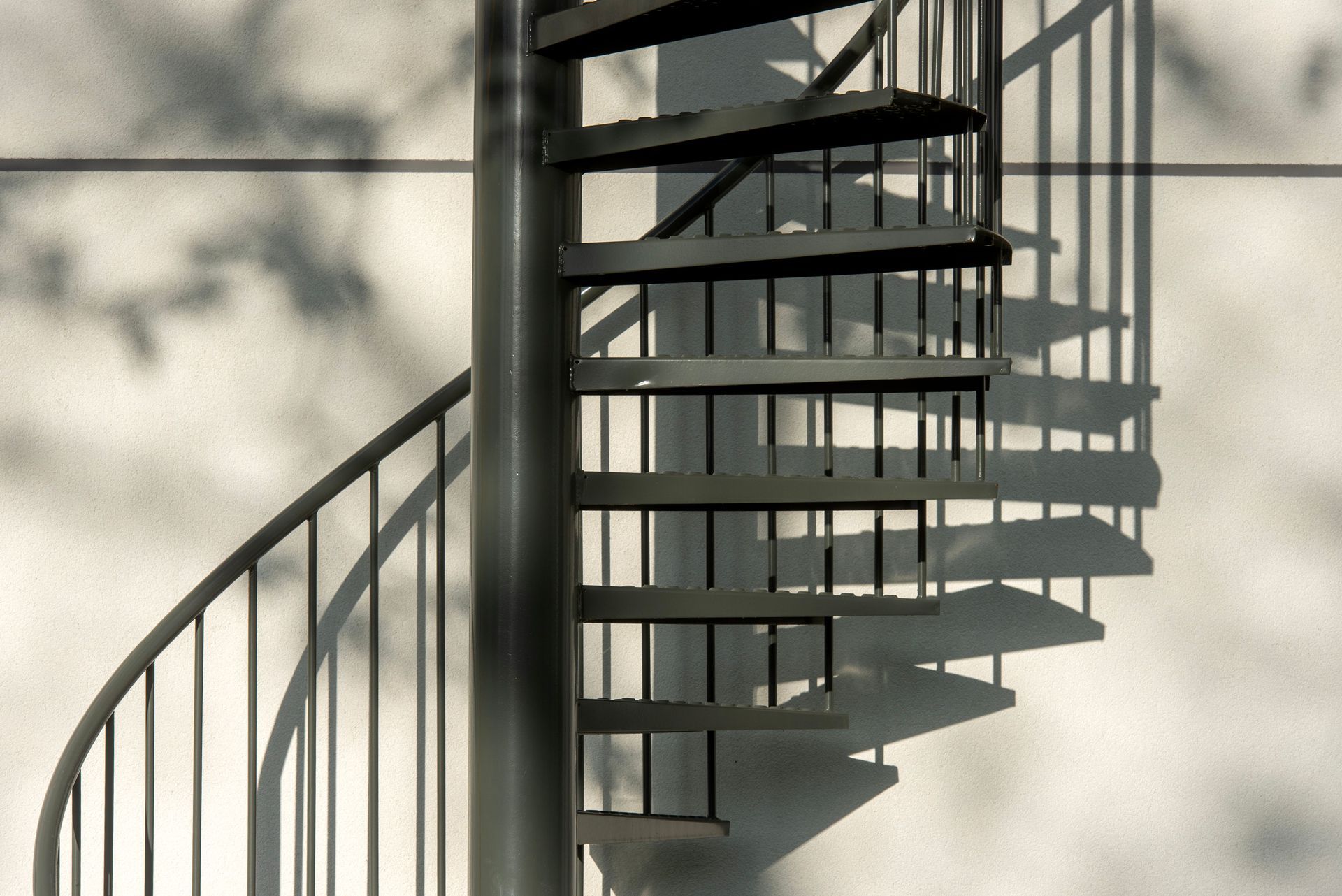 A spiral staircase in the backyard of a home that was positioned using a crane.