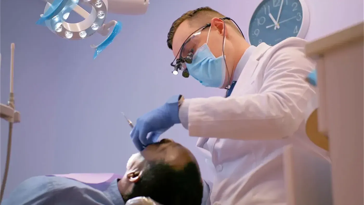 Crown Lengthening: Dr. Godko wearing surgical loupes during treatment