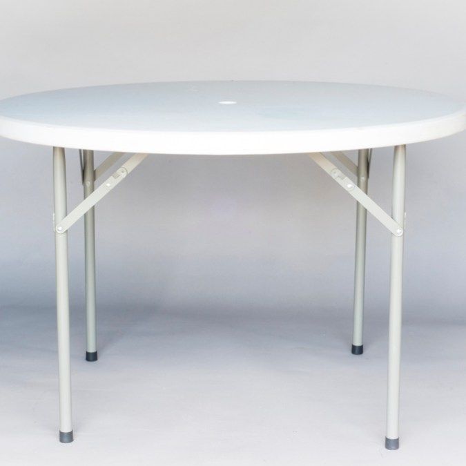 White round folding table with four legs on a light background