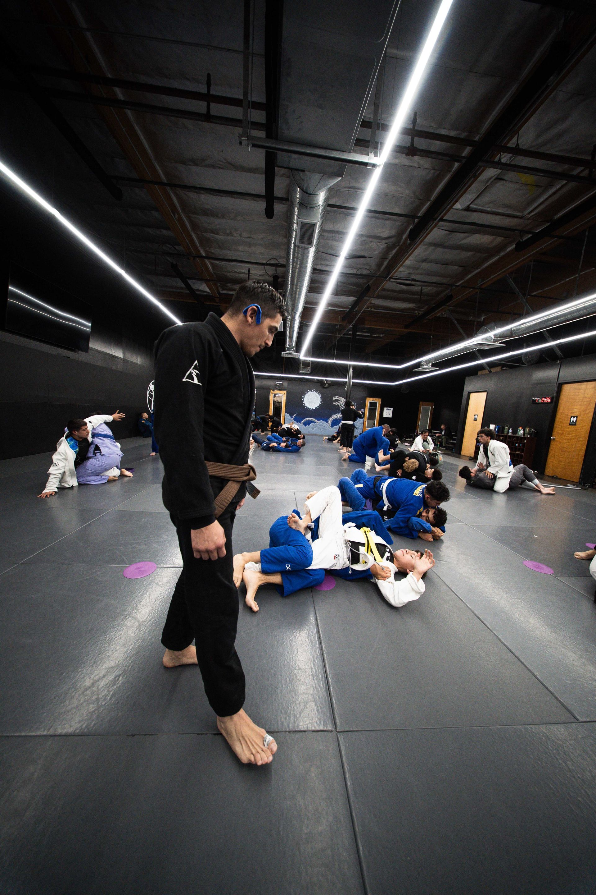 Beginners drilling guard retention and escapes at Cobrinha Southwest in Las Vegas, NV for confidence and control