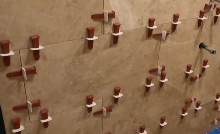 Careful measurements of spacing between shower tiles to make sure things are done right on the first try.