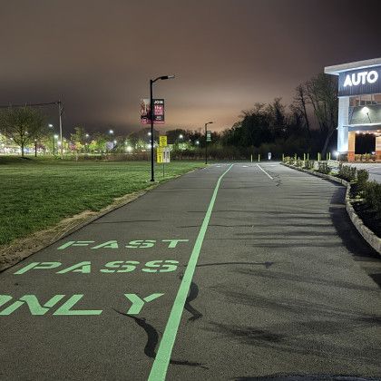 Asphalt path with green 