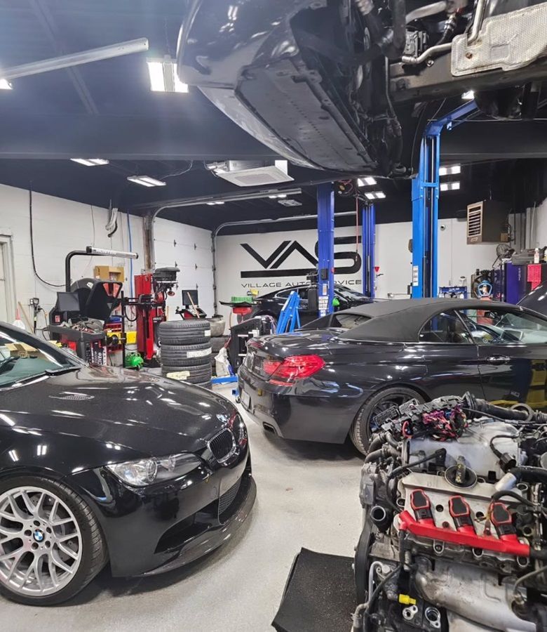 Two black BMWs in for service at our shop at the same time