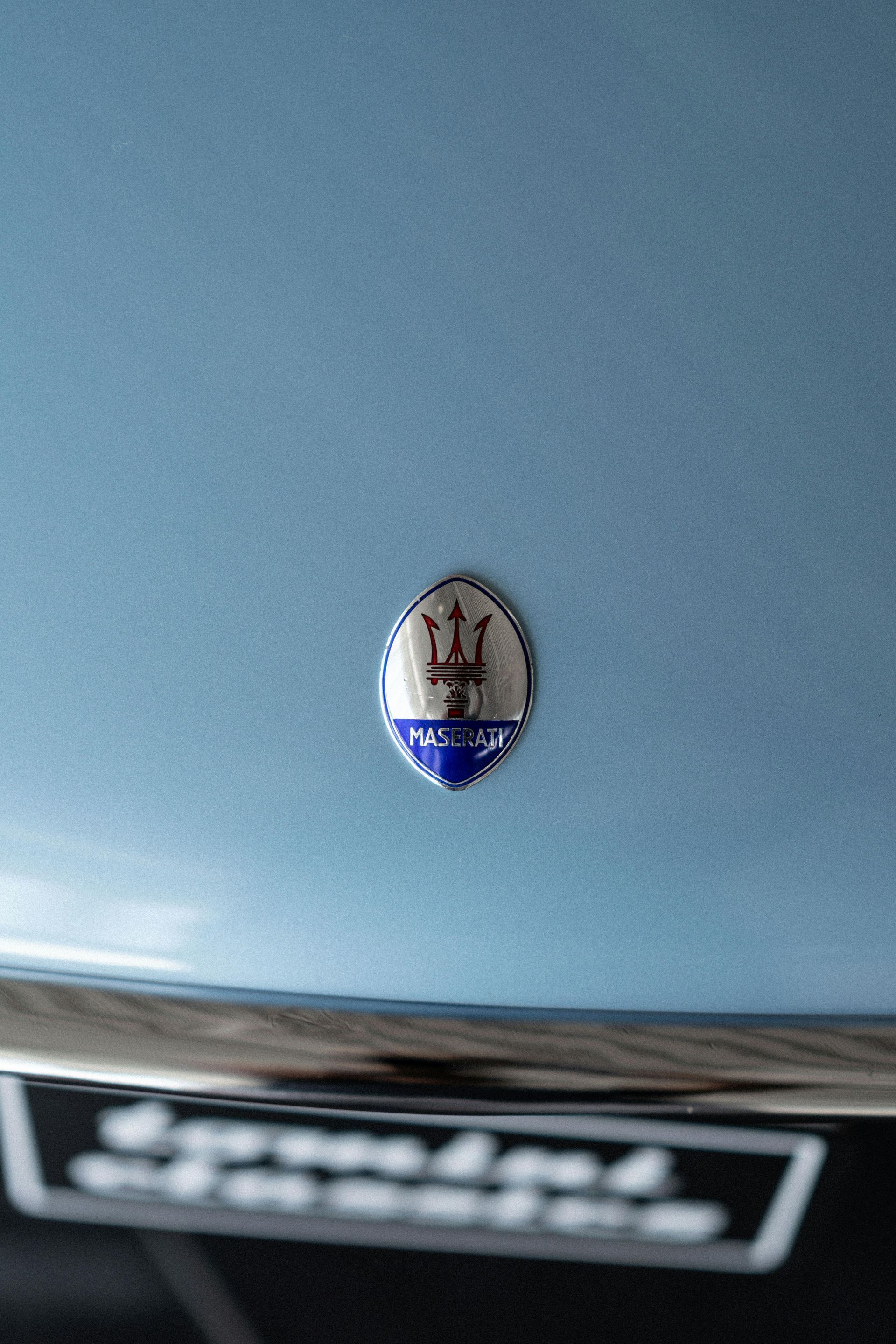 Maserati logo on hood of car