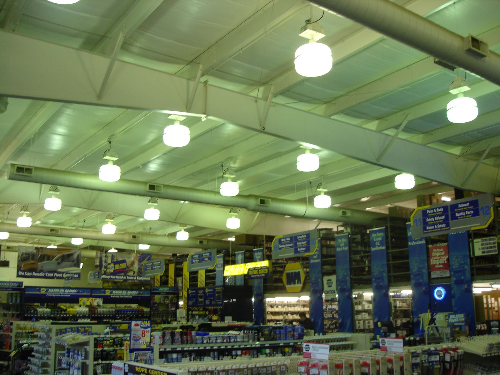 The inside of a store with a sign that says ' tires ' on it