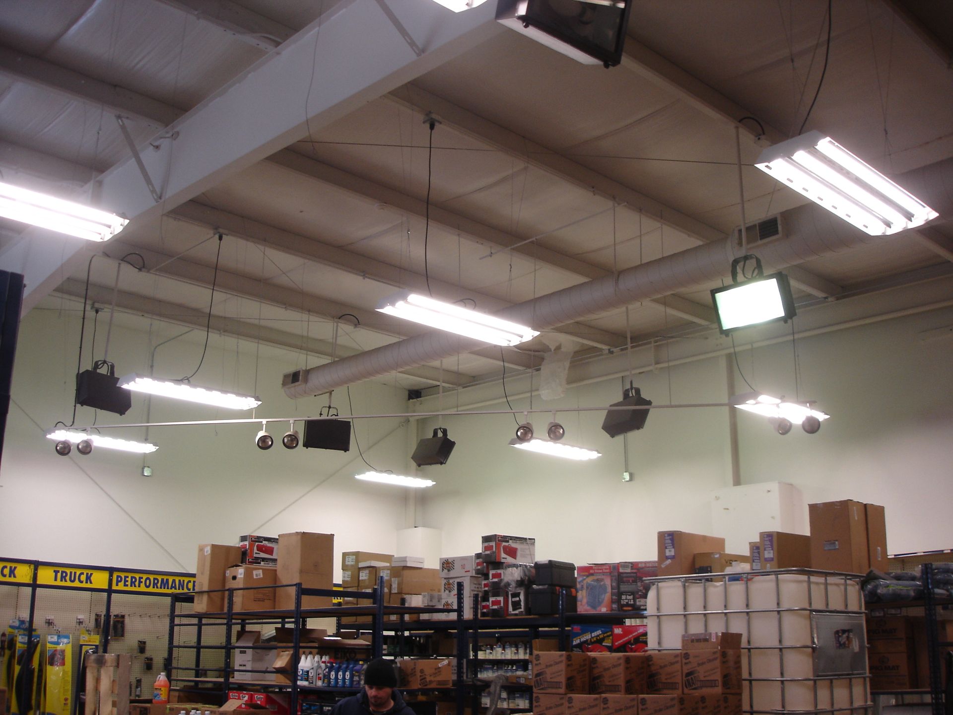 A warehouse with a yellow sign that says ' safety first ' on it