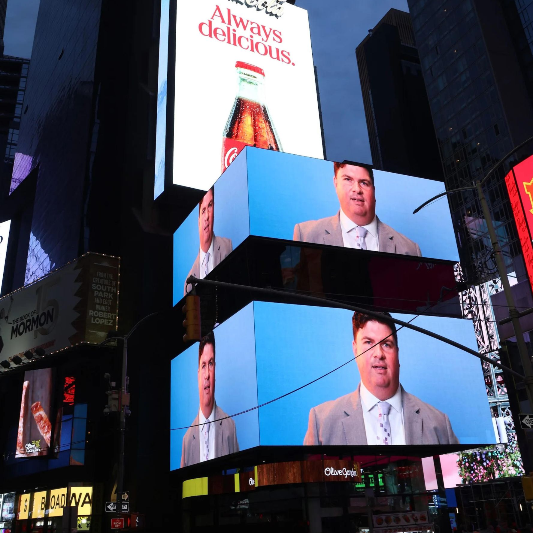 A photo of times square with mulitple ads on billboards
