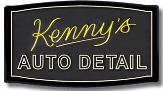 The logo for kenny 's auto detail is black and yellow