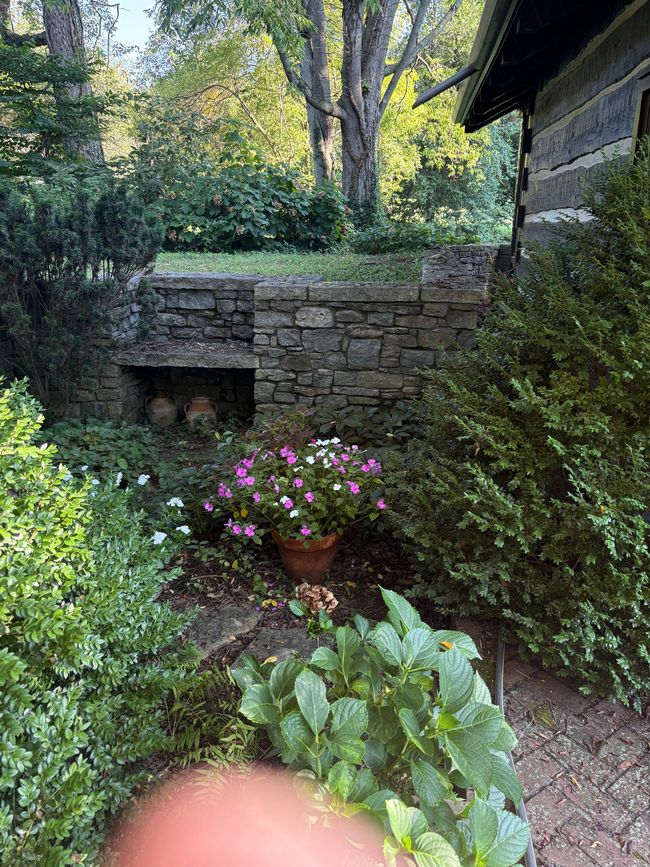 Stone pavilion with limestone columns and pergola