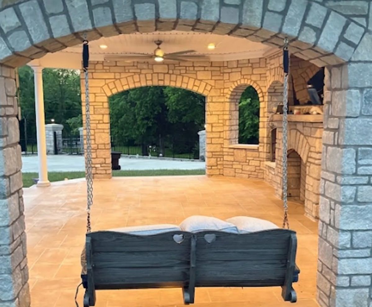 Stone gazebo with swing and fireplace