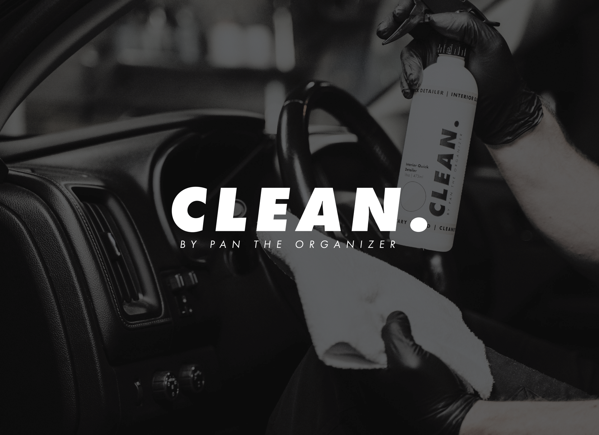 A black and white close-up shows hands in gloves cleaning a car dashboard with a bottle labeled
