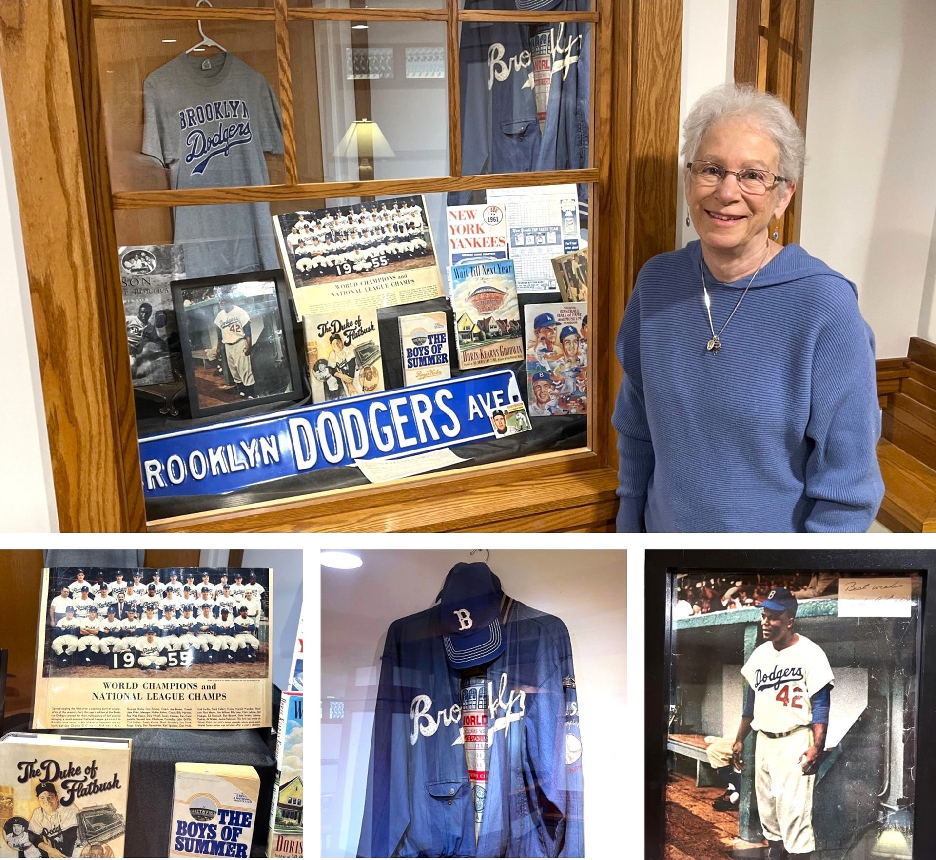 Woman stands by a display case filled with Brooklyn Dodgers memorabilia, including jerseys, photos, and a street sign.