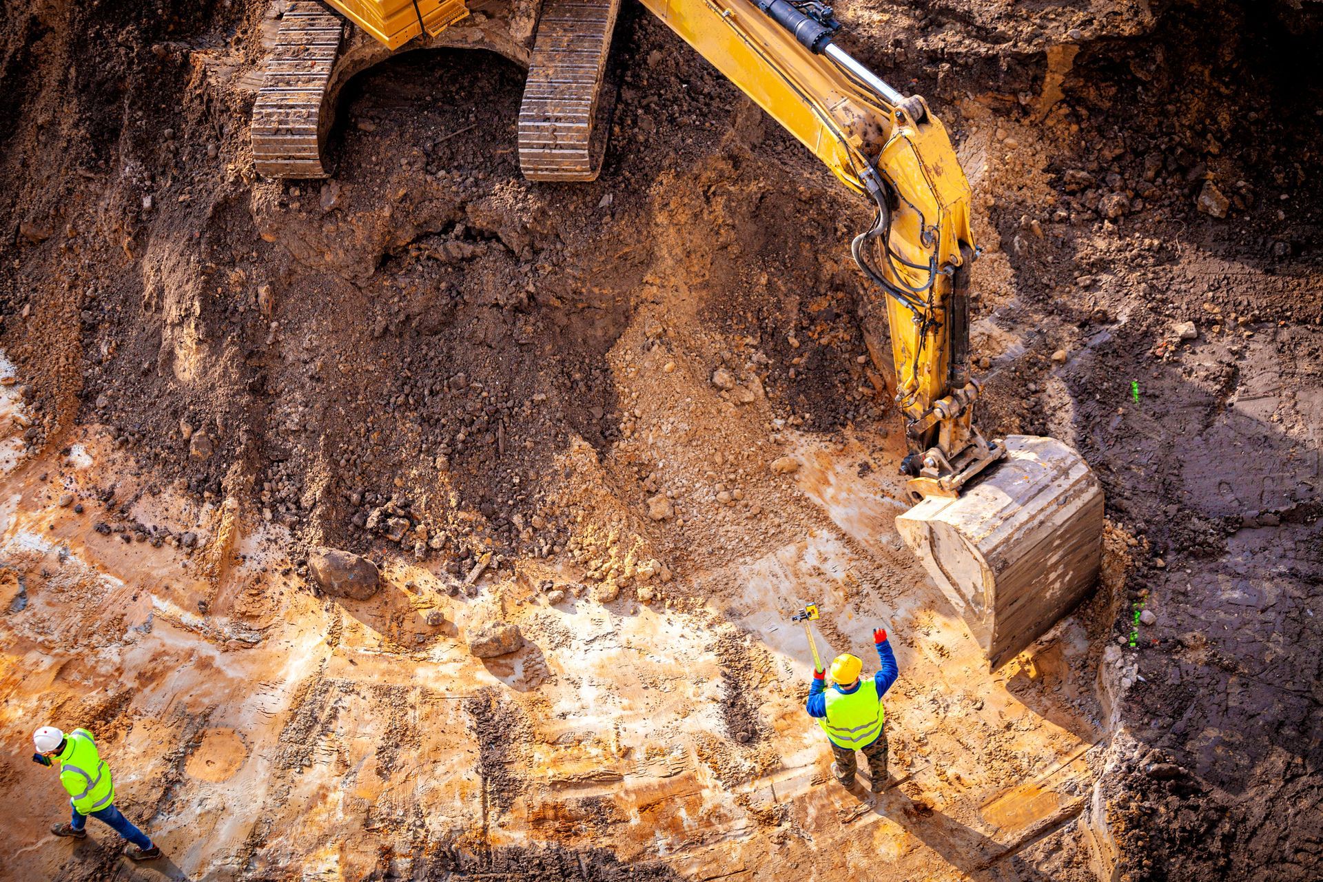 A group of construction workers are working on a construction site.