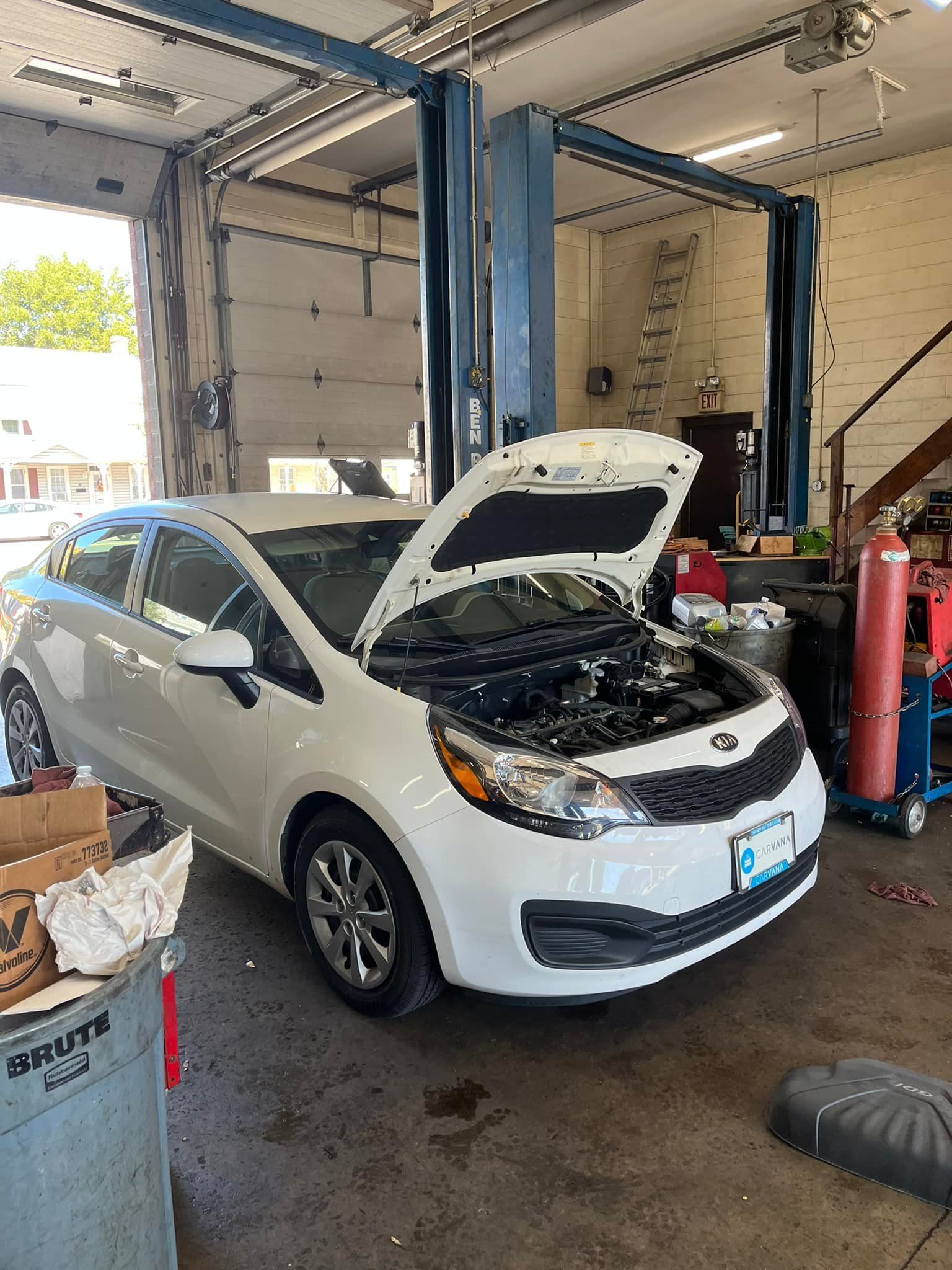 White Kia Rio Hatchback | Airbase Automotive Repair Inc
