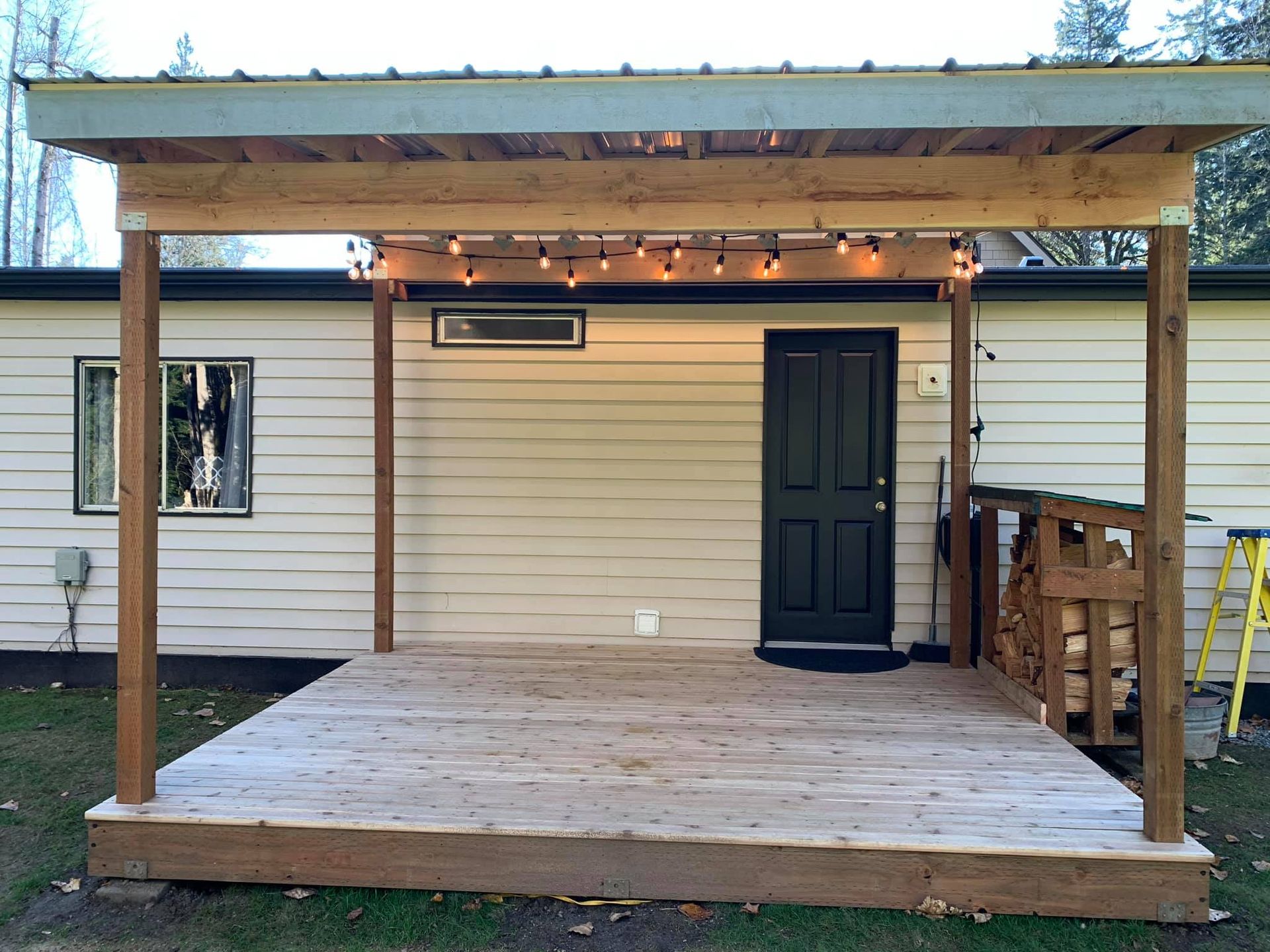 A house with a wooden deck in front of it