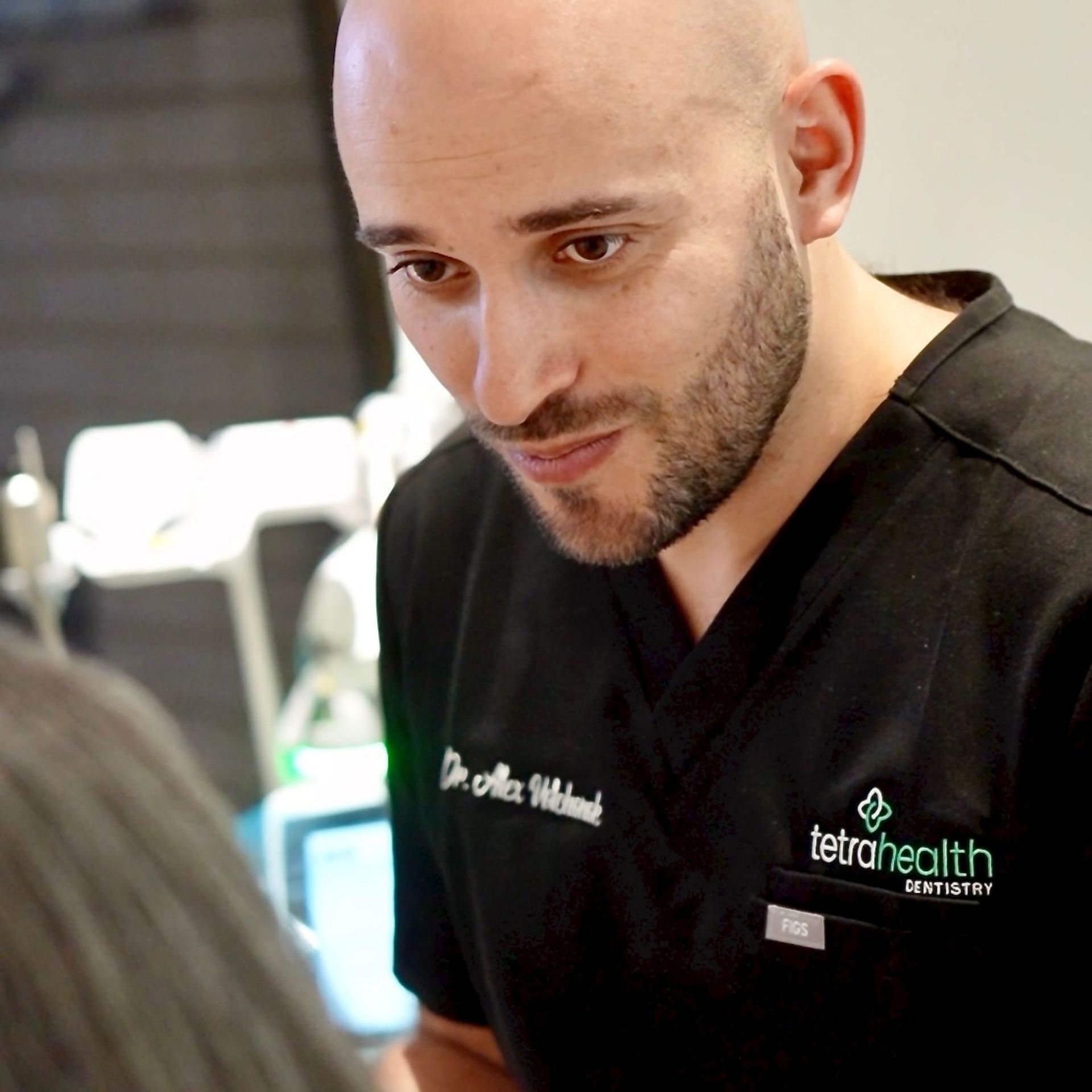 Man in black scrubs with