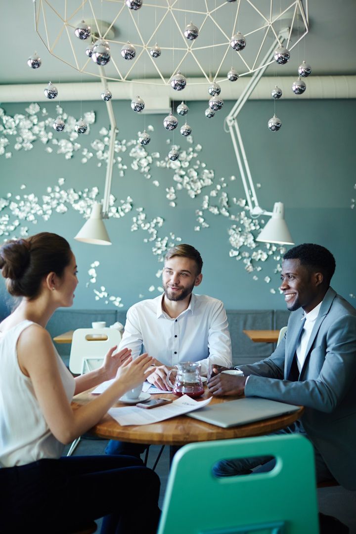 people at a table having a business consulting services discussion