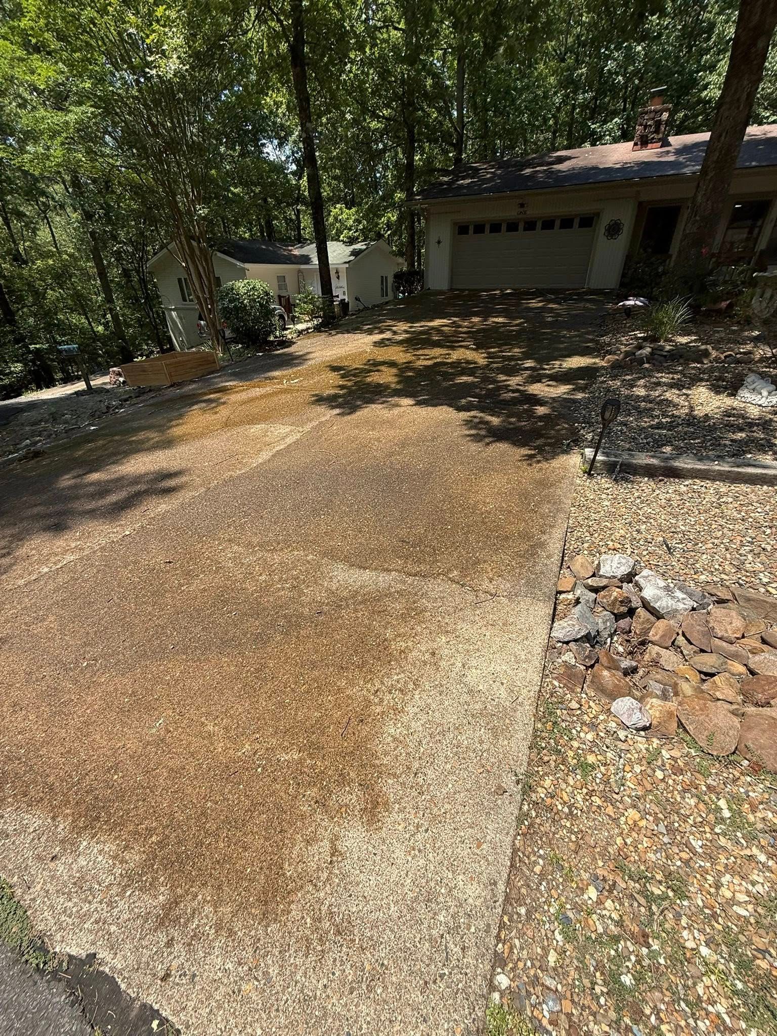 Exterior of beige house with dark smoke stains near two windows and a vent
