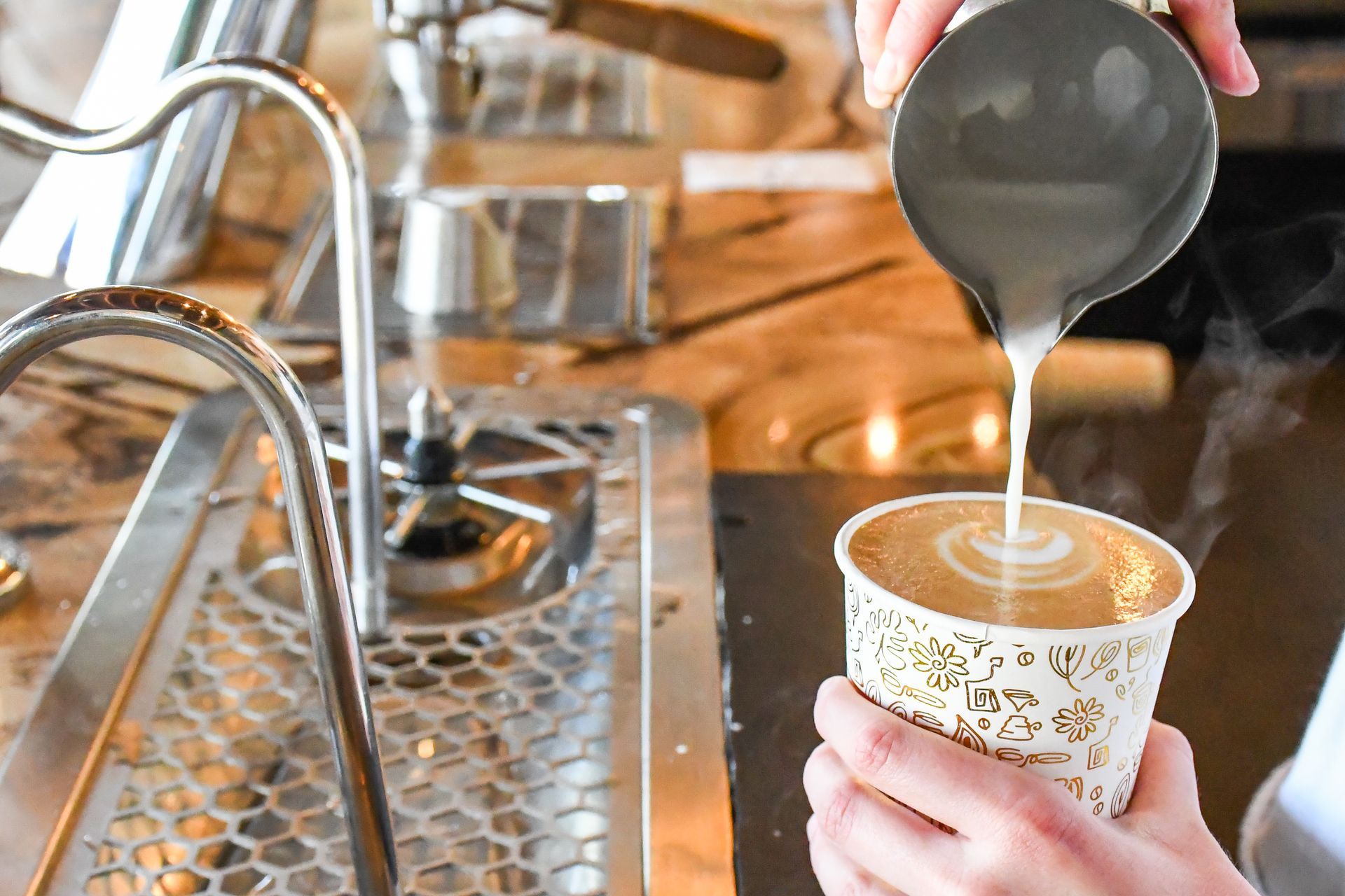 Espresso machine pouring fresh coffee into a cup at Acola Coffee Company Columbia MO