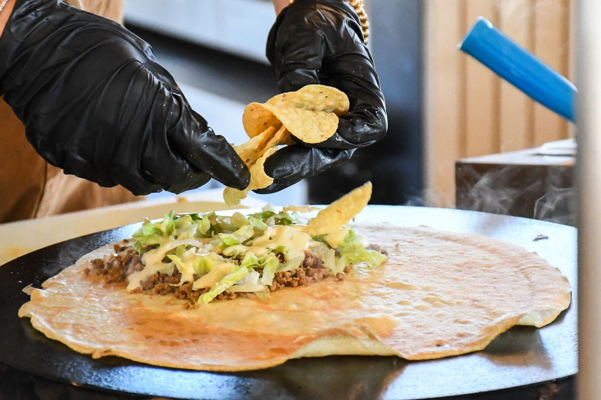 Savory crepe being prepared with fresh toppings at Eat Crepe Love inside Acola Coffee Columbia MO