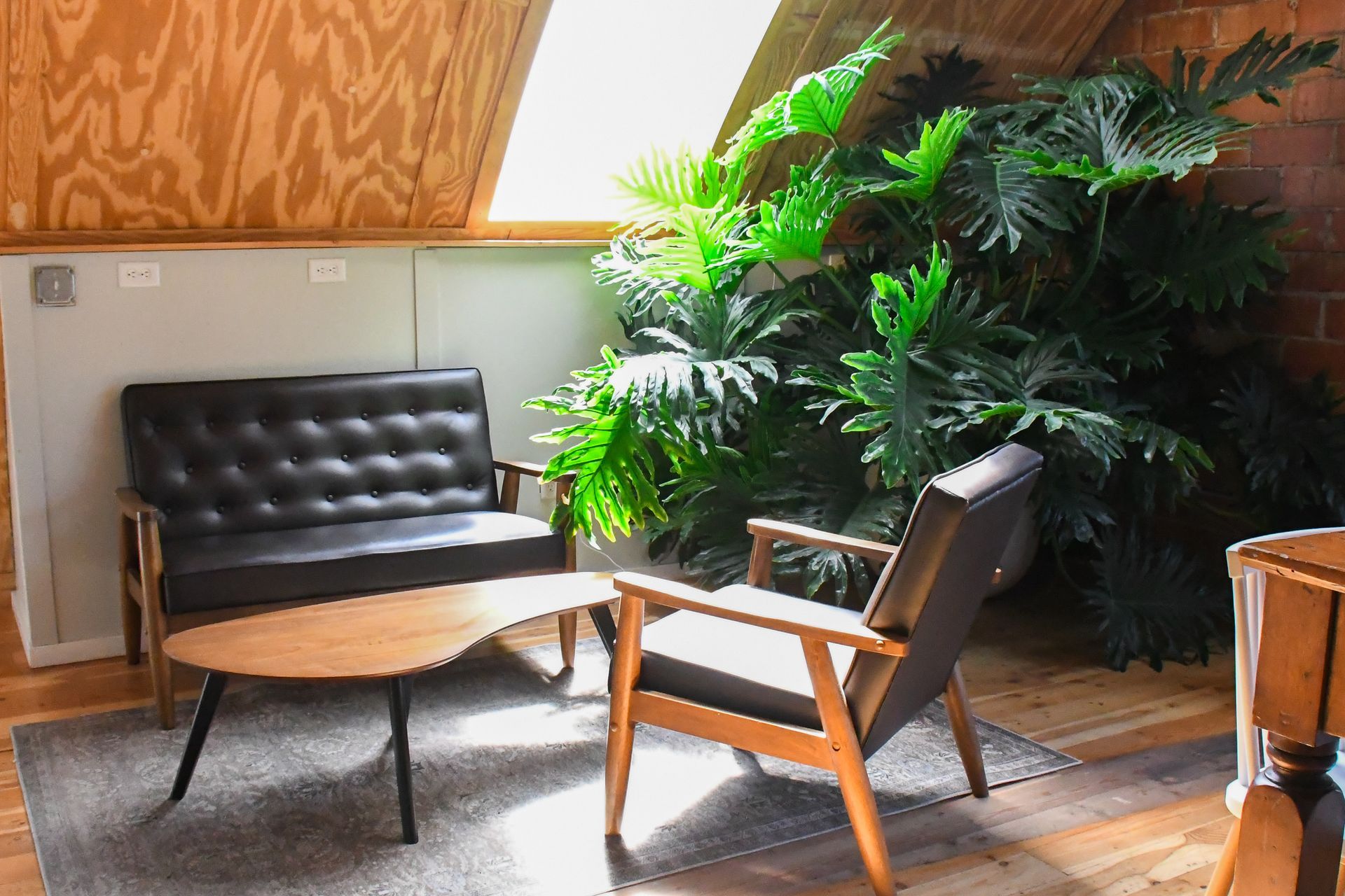 Open event rental area with tables and chairs at Acola Coffee Company Columbia MO